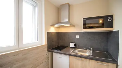 Cuisine ou kitchenette dans l'établissement Appartel 76 Dieppe
