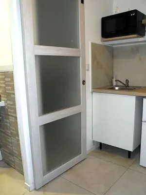 Cuisine ou kitchenette dans l'établissement Appartel 76 Dieppe