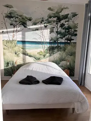 Un ou plusieurs lits dans un hébergement de l'établissement Rez de jardin vue mer Costa Bella