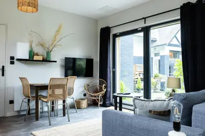 Télévision ou salle de divertissement dans l'établissement Appartement Beau Séjour - Accès Piscine
