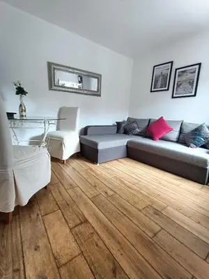 Coin salon dans l'établissement Charmante Maisonnette indépendante avec parking 5 mn Rouen