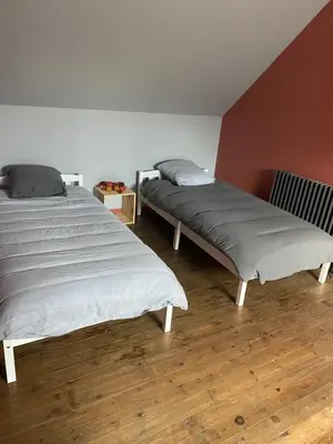 Un ou plusieurs lits dans un hébergement de l'établissement Gîte les Retrouvailles