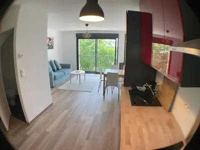 Coin salon dans l'établissement Superbe appartement avec vue sur la tour Eiffel