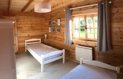 Un ou plusieurs lits dans un hébergement de l'établissement Le Chalet Caux-Marin