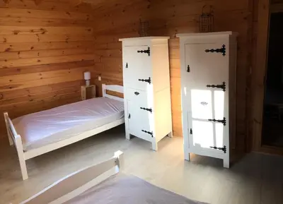 Un ou plusieurs lits dans un hébergement de l'établissement Le Chalet Caux-Marin