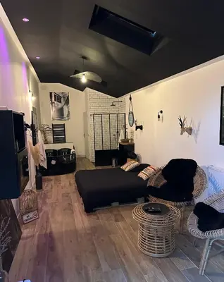 Coin salon dans l'établissement Apt 35 m2 Baignoire Balnéo terrasse privée