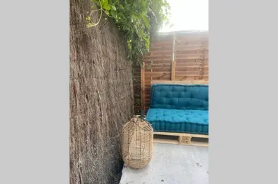 Coin salon dans l'établissement Apt 35 m2 Baignoire Balnéo terrasse privée