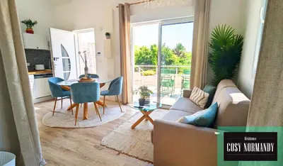 Télévision ou salle de divertissement dans l'établissement Cosy Normandy - 04