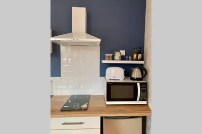 Cuisine ou kitchenette dans l'établissement Nid douillet à 5 minutes des plages