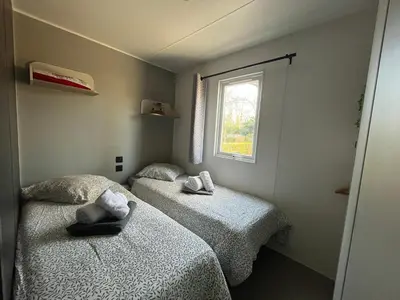 Un ou plusieurs lits dans un hébergement de l'établissement Paris Camping Ile du Roi