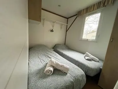 Un ou plusieurs lits dans un hébergement de l'établissement Paris Camping Ile du Roi