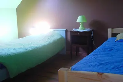 Un ou plusieurs lits dans un hébergement de l'établissement Maison Le four à chaux