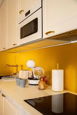 Cuisine ou kitchenette dans l'établissement Le Petit Versailles
