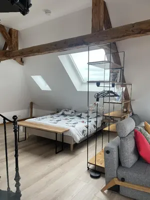 Un ou plusieurs lits dans un hébergement de l'établissement Le Loft de Flore