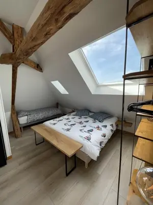 Un ou plusieurs lits dans un hébergement de l'établissement Le Loft de Flore