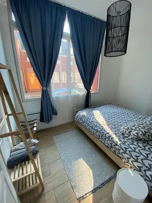 Un ou plusieurs lits dans un hébergement de l'établissement Appartement Rez de chaussé