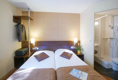 Un ou plusieurs lits dans un hébergement de l'établissement Hôtel Inn Design & Restaurant Amiens