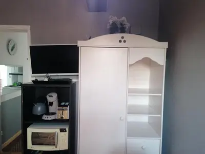 Cuisine ou kitchenette dans l'établissement Charmant Appartement 10mn Rouen