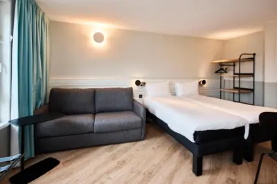 Un ou plusieurs lits dans un hébergement de l'établissement ibis Styles Paris Poissy