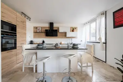 Cuisine ou kitchenette dans l'établissement L'Impressionniste
