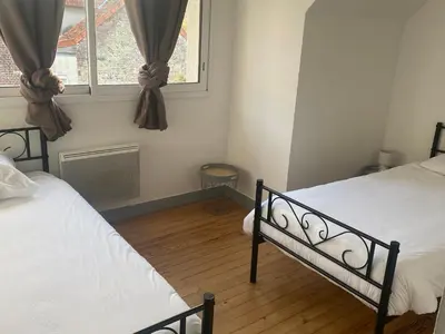 Un ou plusieurs lits dans un hébergement de l'établissement Maison Bord de Mer