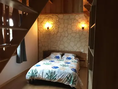 Un ou plusieurs lits dans un hébergement de l'établissement Le chalet