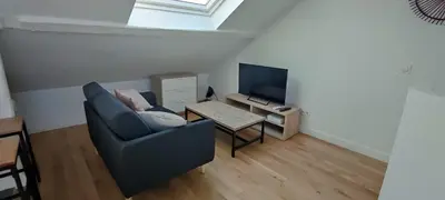 Télévision ou salle de divertissement dans l'établissement Grand LOFT à Poissy