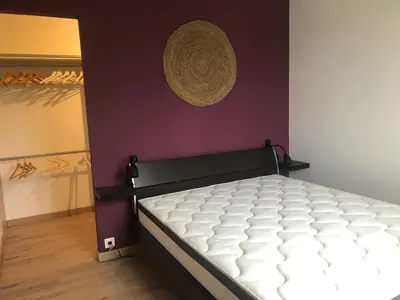 Un ou plusieurs lits dans un hébergement de l'établissement Maison chaleureuse à la campagne