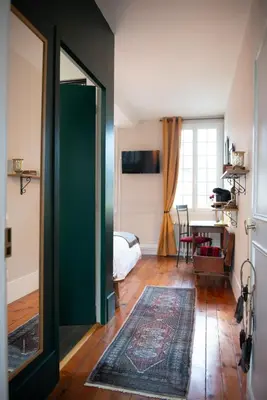Télévision ou salle de divertissement dans l'établissement La Maison Carpe Diem