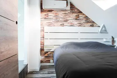 Un ou plusieurs lits dans un hébergement de l'établissement L’Auberge de papa