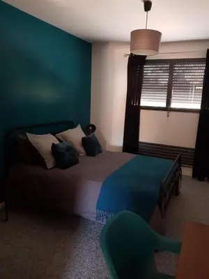 Un ou plusieurs lits dans un hébergement de l'établissement Escapade Amiens - Two-Bedroom Apartment