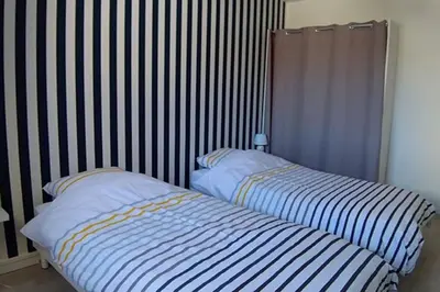 Un ou plusieurs lits dans un hébergement de l'établissement En famille à Dieppe by Holidieppe