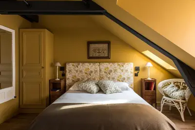 Un ou plusieurs lits dans un hébergement de l'établissement La Villa Augustine