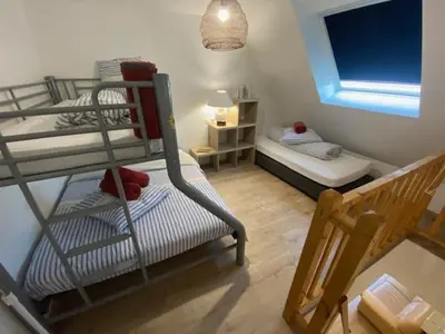Un ou plusieurs lits dans un hébergement de l'établissement DIEPPE GITES BEAUREGARD