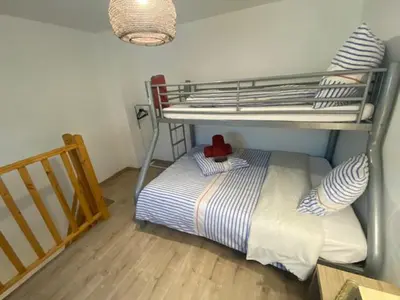 Un ou plusieurs lits dans un hébergement de l'établissement DIEPPE GITES BEAUREGARD
