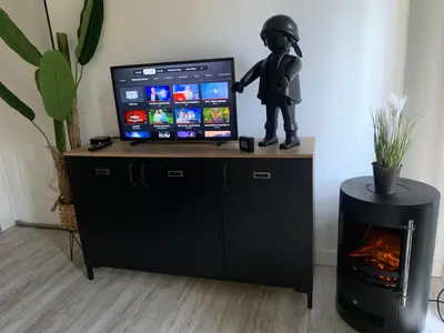 Télévision ou salle de divertissement dans l'établissement Chambre à la Noye