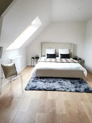 Un ou plusieurs lits dans un hébergement de l'établissement Maison Design entre Paris, Deauville et Rouen