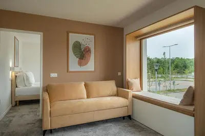 Coin salon dans l'établissement Hôtel Amiens Sud