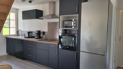 Cuisine ou kitchenette dans l'établissement La Grange