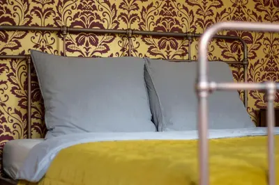 Un ou plusieurs lits dans un hébergement de l'établissement Sfeervolle b&b Le Moulin de la Place