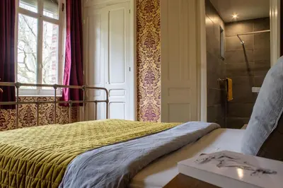 Un ou plusieurs lits dans un hébergement de l'établissement Sfeervolle b&b Le Moulin de la Place