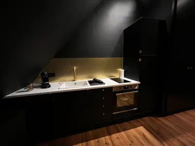 Cuisine ou kitchenette dans l'établissement LA SUITE ISAHORA. Les Locations ISAHORA c'est aussi plusieurs appart' de Standing à 2 pas du Château d'Eu, des Falaises du Tréport, de MERS les Bains et Aux portes de la BAIE DE SOMME