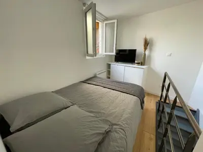 Un ou plusieurs lits dans un hébergement de l'établissement Jolie duplex central climatisé