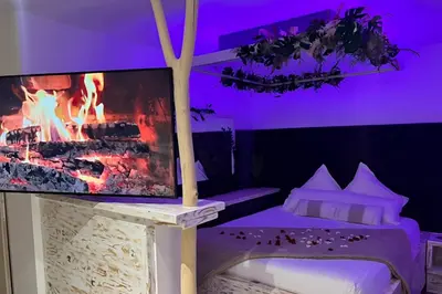 Un ou plusieurs lits dans un hébergement de l'établissement Vanadis, Suites d'exceptions & spa - LE BALNEO