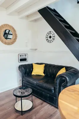 Coin salon dans l'établissement L'Effet Mer - Duplex - Proche Plage - 2 PERS
