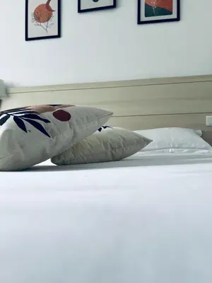 Un ou plusieurs lits dans un hébergement de l'établissement Vieille tour Hotel centre Rouen