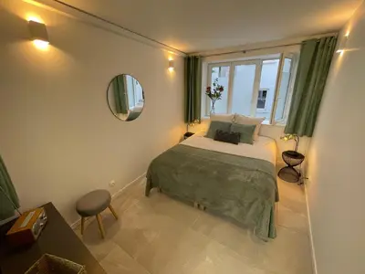 Un ou plusieurs lits dans un hébergement de l'établissement Loft central climatisé avec verrière