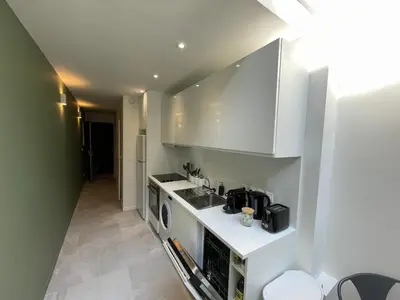 Cuisine ou kitchenette dans l'établissement Loft central climatisé avec verrière