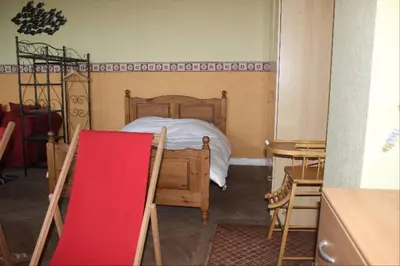 Un ou plusieurs lits dans un hébergement de l'établissement Villa Normande