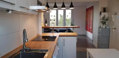 Cuisine ou kitchenette dans l'établissement Le Bleu - Parking - 2 chambres - 1 bureau